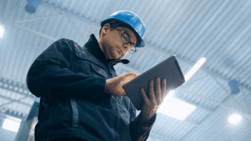 worker using tablet in factory