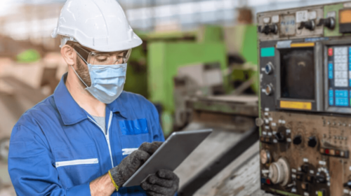 worker doing maintenance in factory